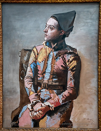 231031SeatedHarlequinPabloPicasso